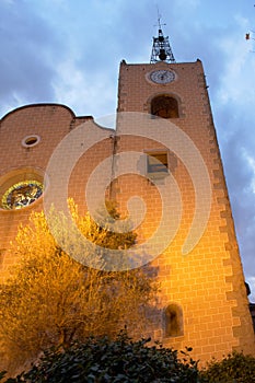 The bell tower illuminated in the evening photo